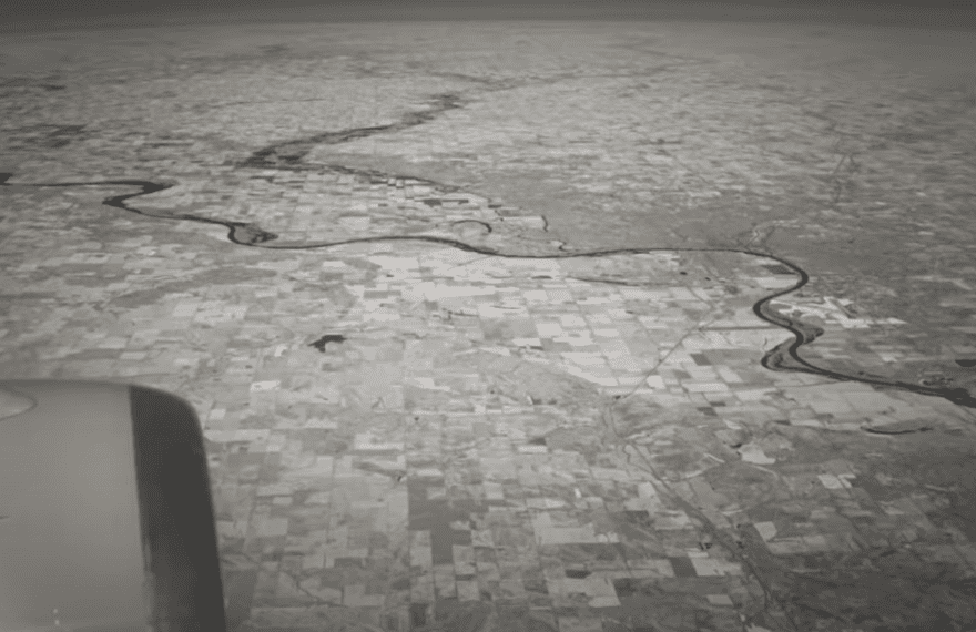 Aerial view of land with horizon appearing flat, supporting the flat Earth theory.