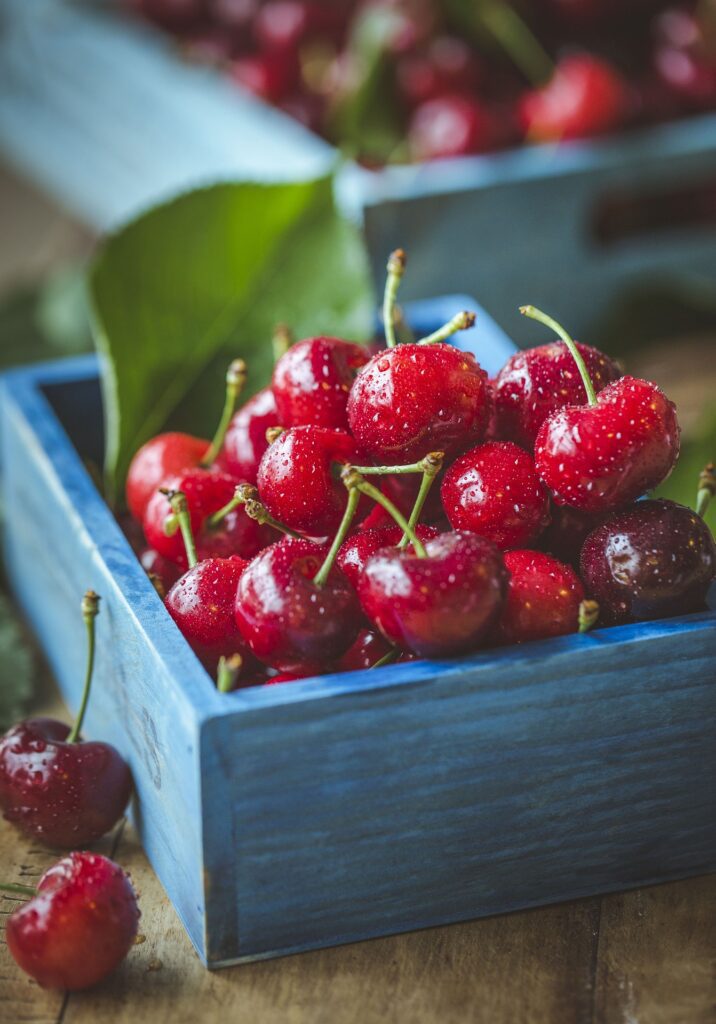 Red cherries in a basket - known for their liver-cleansing properties.