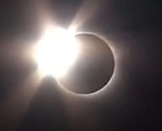 Solar Eclipse with the moon passing in front of the sun.