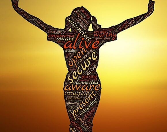 Animated image of a woman filled with positive words: secure, alive, open, present, awake - related to the spiritual awakening topic