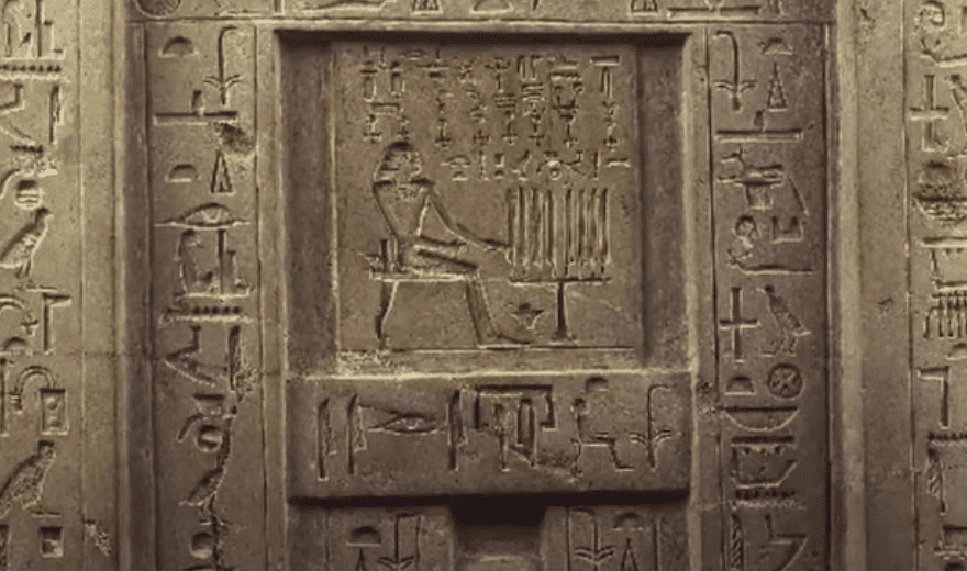 An old Egyptian stone depicting hieroglyphs and symbols, representing the complex and fascinating topic of Egyptian spirituality