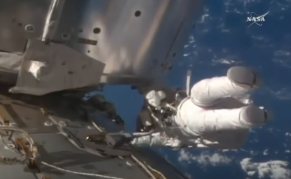 Astronaut in space performing a spacewalk