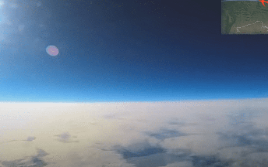 Aerial view from a plane showing a flat horizon, providing evidence that the world is not a globe