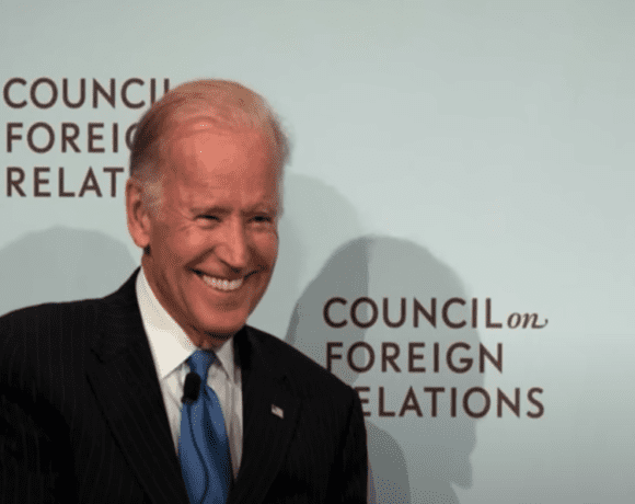 Joe Biden standing in front of the Council on Foreign Relations (CFR) logo wall.