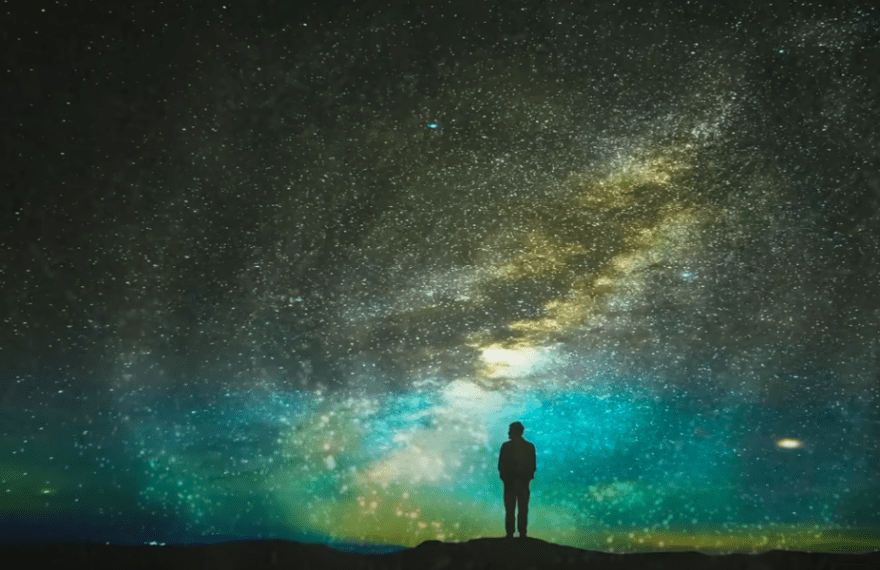 Man stargazing, night sky, personal growth, universal connection