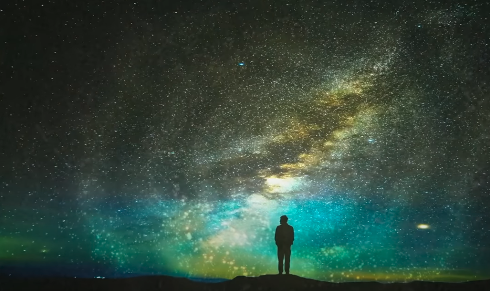 Man stargazing, night sky, personal growth, universal connection