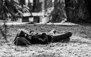 relaxing in the park man laying down