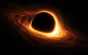 Artist illustration of a glowing orange ring surrounding a black hole shadow.